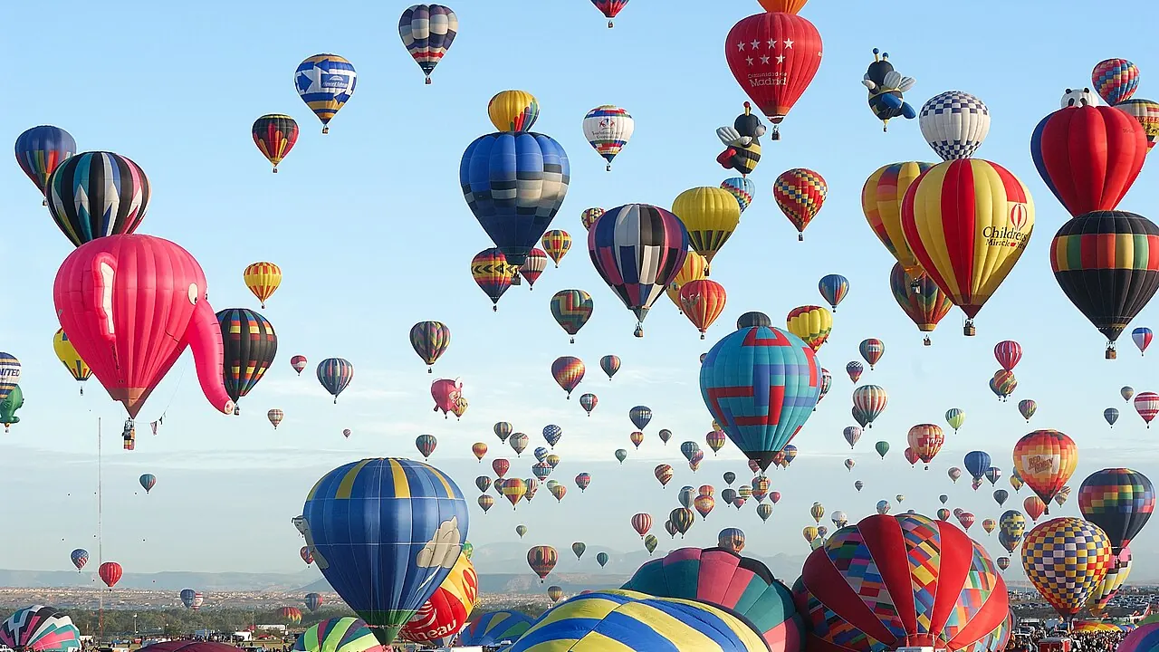Hundreds of balloons rising during a mass ascension at the Albuquerque International Balloon Fiesta