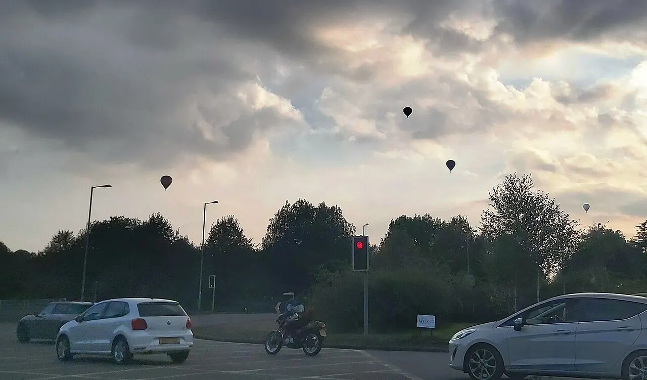 Hot air balloons in the evening sky over Bath