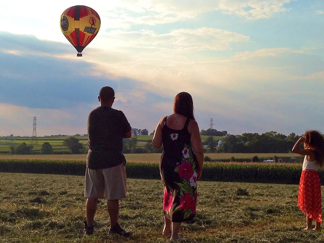 People in a field watching a balloon at Bird-in-Hand, Pennsylvania