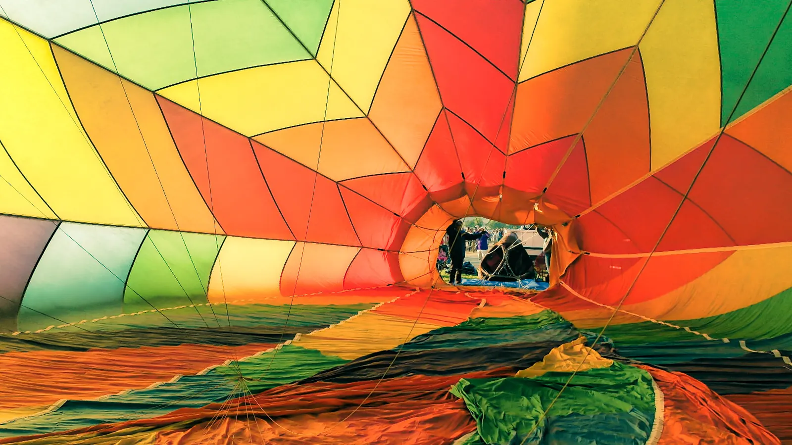 Looking up inside a hot air balloon envelope during inflation