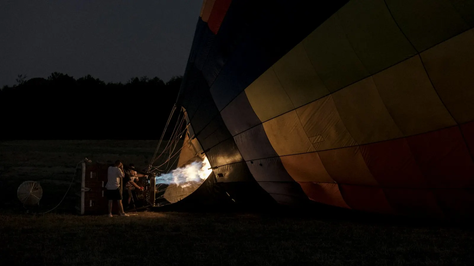 A balloon burner firing at dawn in Tavarnelle Val di Pesa