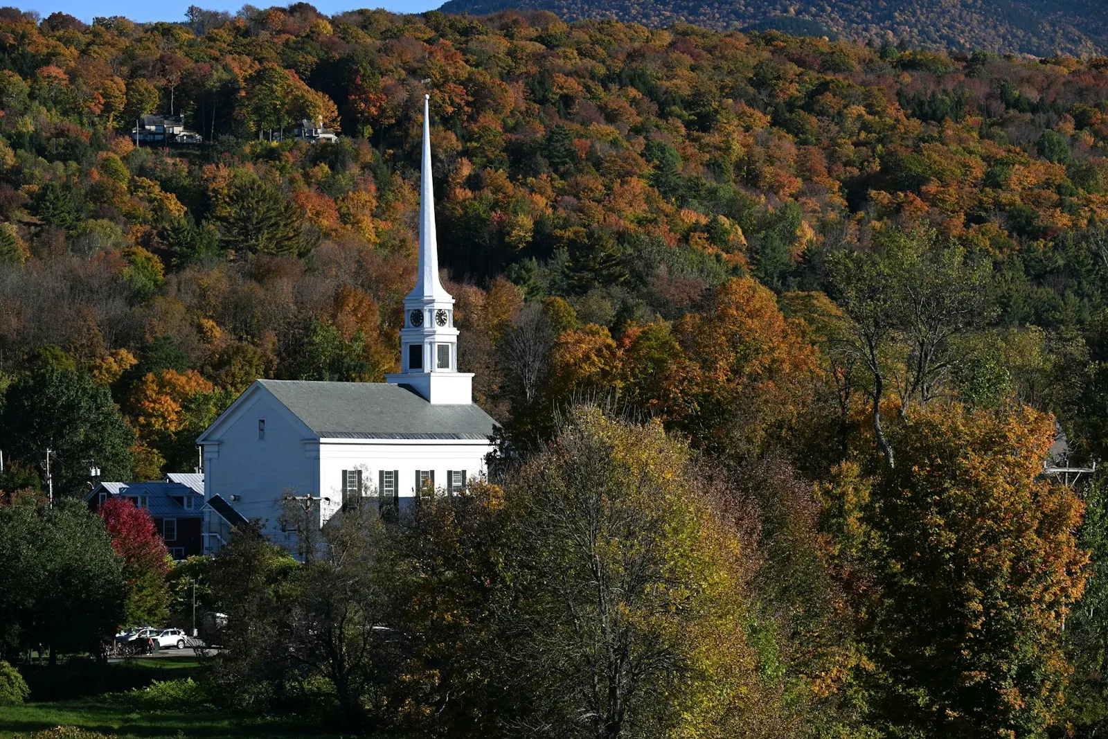 The white church in Stowe, Vermont, in autumn